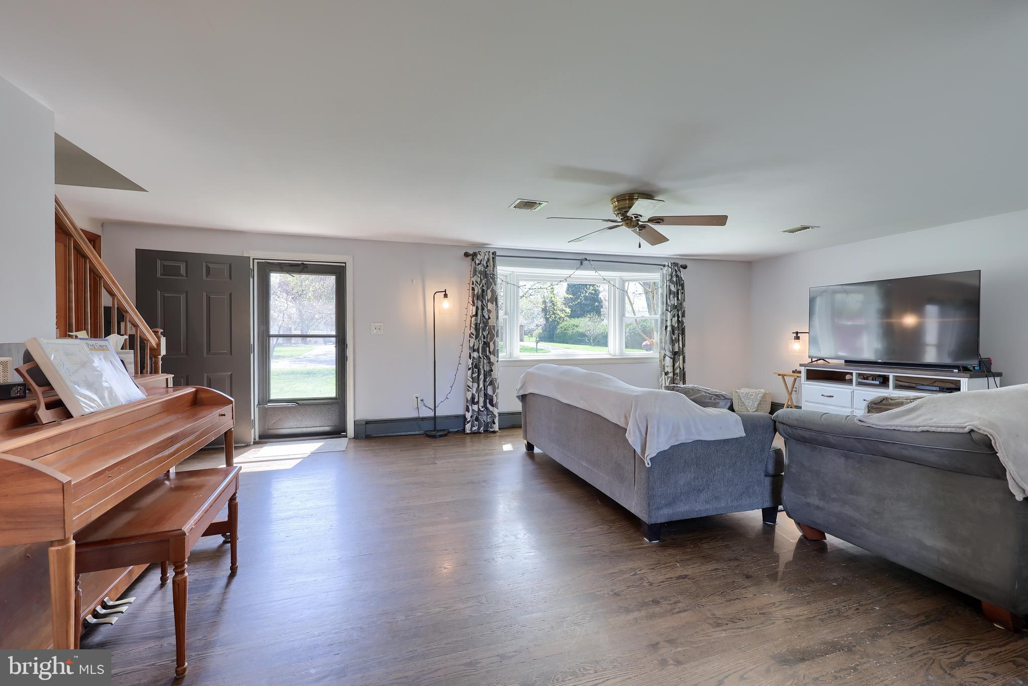 2033 Robindale Avenue Lancaster, PA 17601 - Photo 9 of 47 a living room with furniture and a flat screen tv