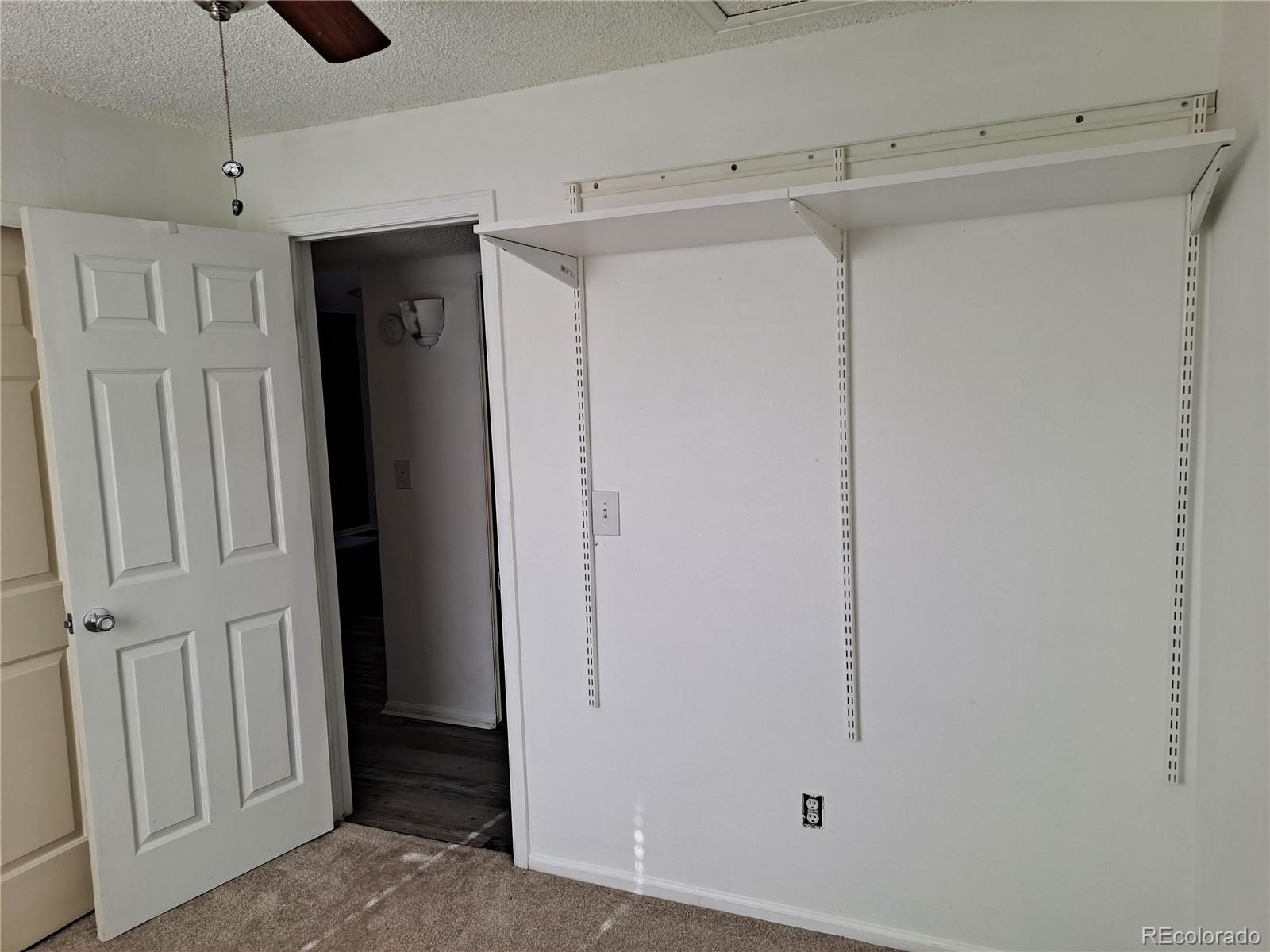 2575 South Syracuse Way, Unit J308 Denver, CO 80231 - Photo 11 of 14 a view of closet area