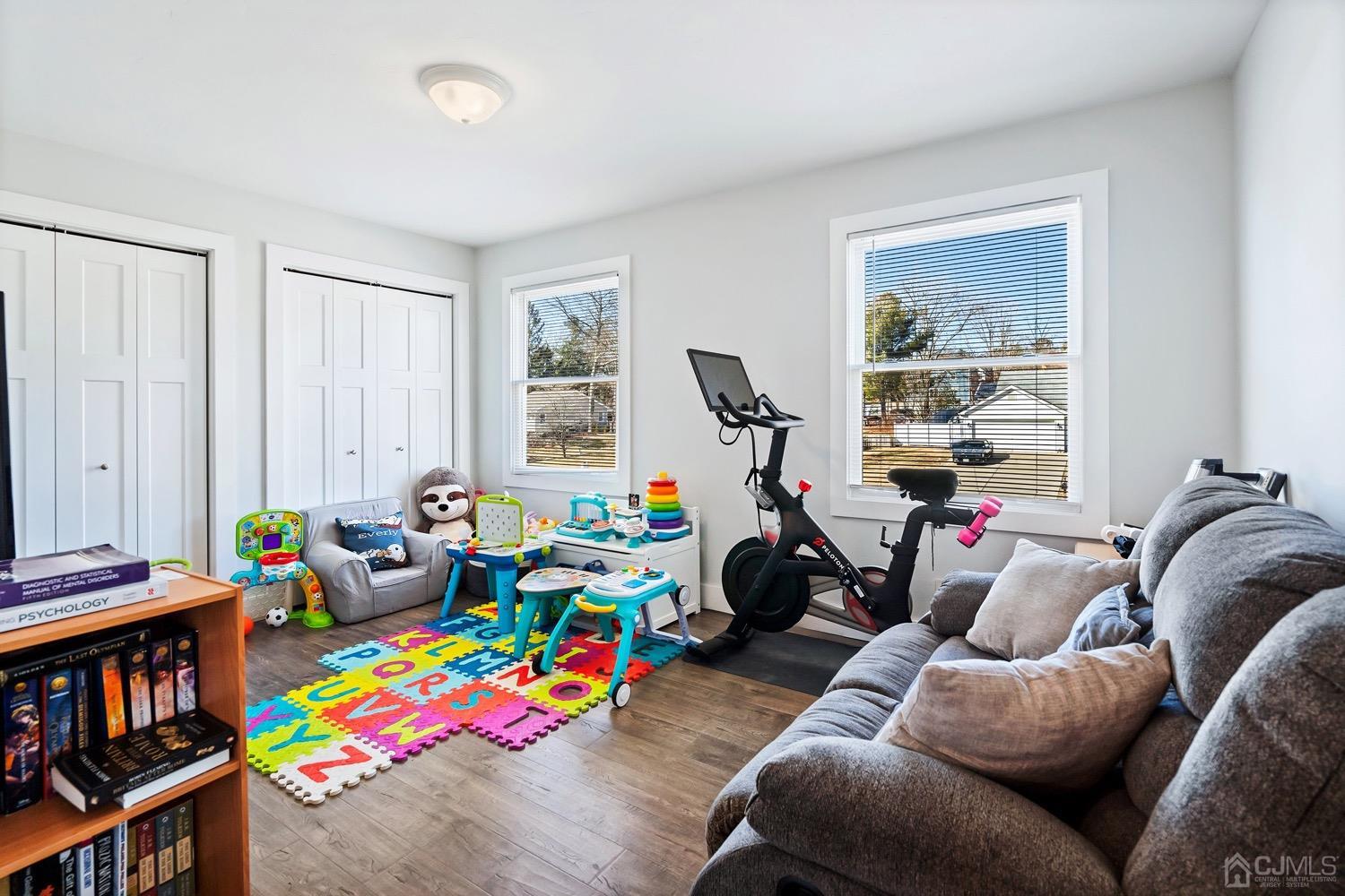 18 4th Street Barnegat, NJ 08005 - Photo 16 of 27 a living room with furniture and a book shelf