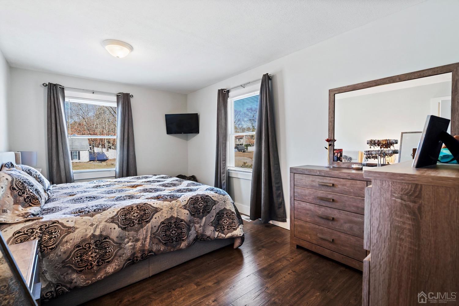 18 4th Street Barnegat, NJ 08005 - Photo 18 of 27 a bedroom with a bed and a flat tv screen on dresser
