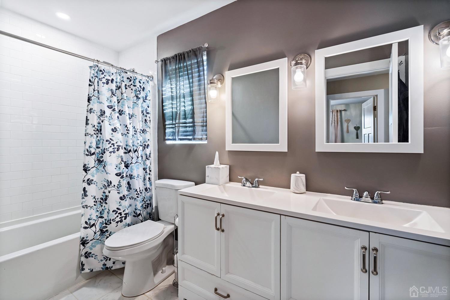 18 4th Street Barnegat, NJ 08005 - Photo 19 of 27 a bathroom with a sink a toilet and shower