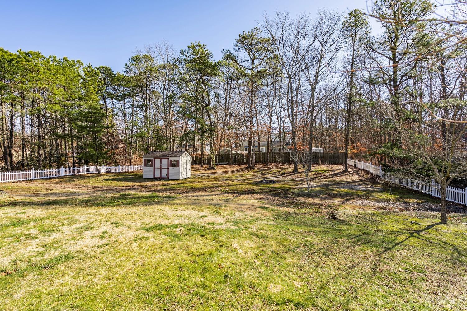 18 4th Street Barnegat, NJ 08005 - Photo 20 of 27 a swimming pool with trees in the background