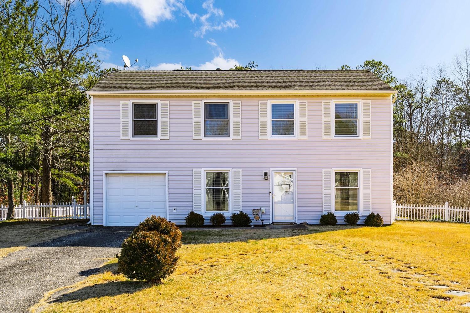 18 4th Street Barnegat, NJ 08005 - Photo 2 of 27 a front view of a house with a yard