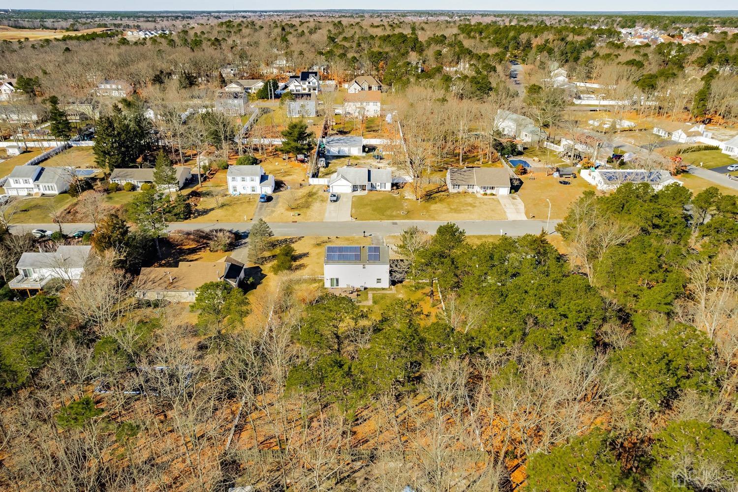 18 4th Street Barnegat, NJ 08005 - Photo 25 of 27 an aerial view of residential building with parking space