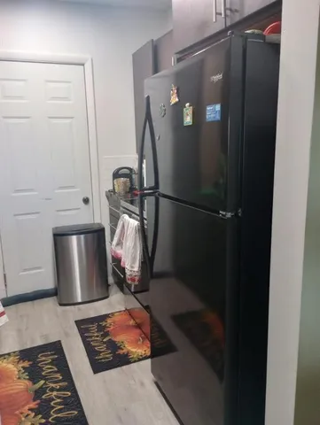 a close view of a utility room with dryer and washer