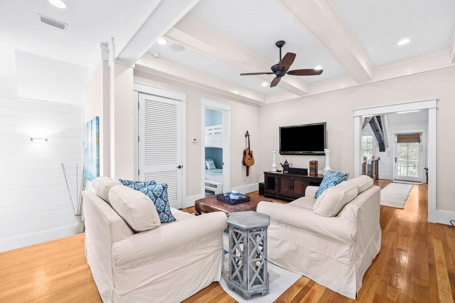 76 Tidepool Lane Watersound, FL 32461 - Photo 25 of 41 a living room with furniture a ceiling fan and a flat screen tv