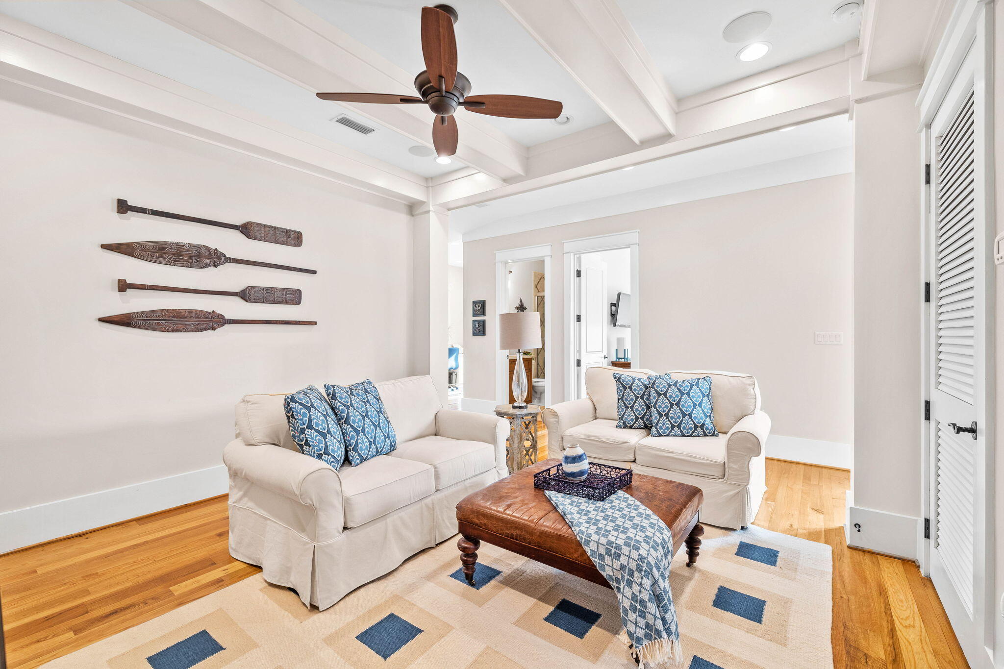 76 Tidepool Lane Watersound, FL 32461 - Photo 26 of 41 a living room with furniture and a ceiling fan