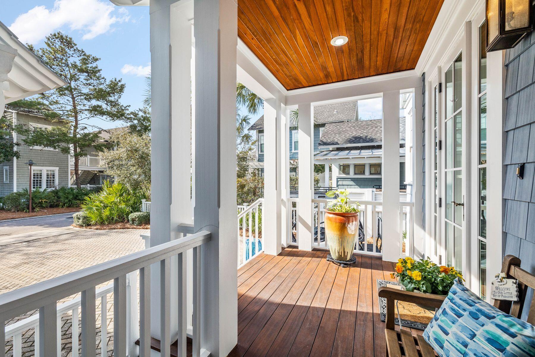 76 Tidepool Lane Watersound, FL 32461 - Photo 28 of 41 a view of a balcony with wooden floor and furniture