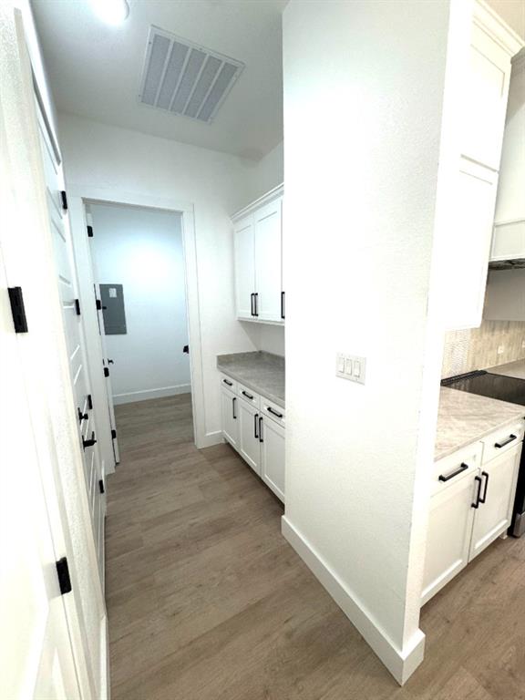 1106 East Sixth Street Springtown, TX 76082 - Photo 13 of 25 a bathroom with a double vanity sink mirror and shower