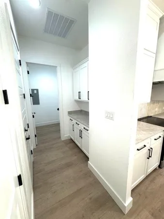a bathroom with a double vanity sink mirror and shower