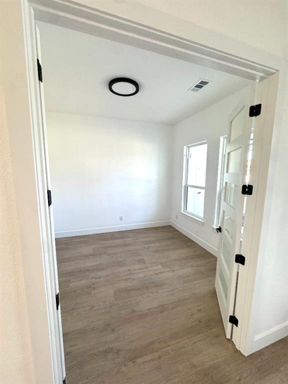 1106 East Sixth Street Springtown, TX 76082 - Photo 22 of 25 an empty room with windows