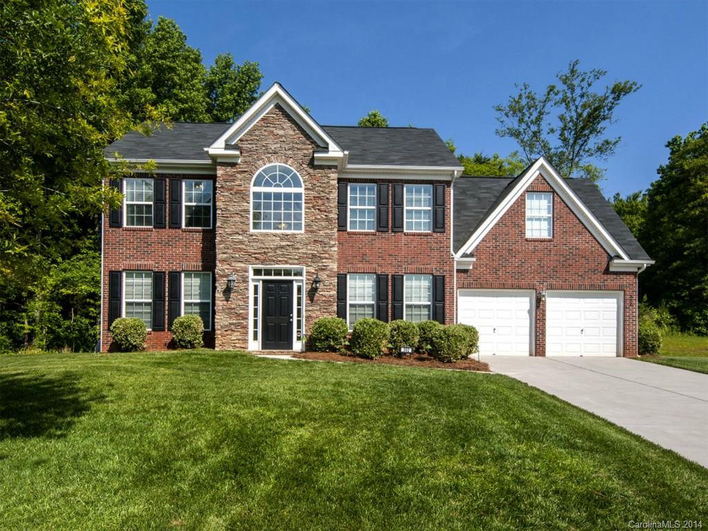 392 Wellridge Drive Fort Mill, SC 29708 - Photo 1 of 21 a front view of a house with a yard and trees