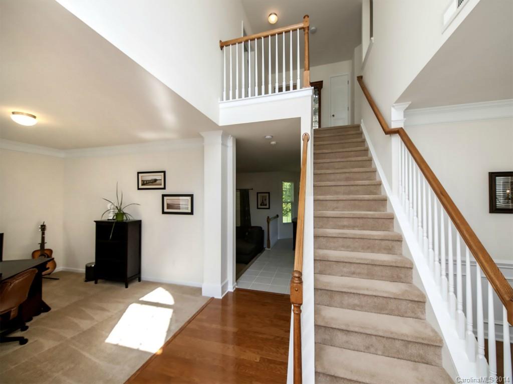 392 Wellridge Drive Fort Mill, SC 29708 - Photo 2 of 21 a view of a hallway with wooden floor and stairs
