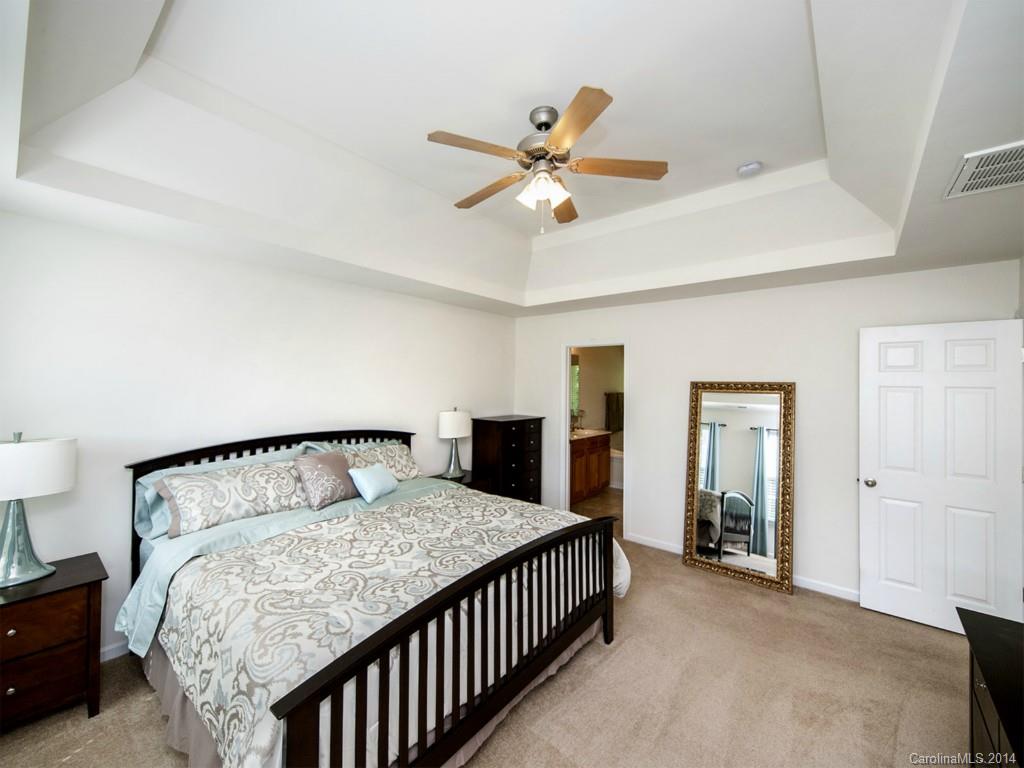 392 Wellridge Drive Fort Mill, SC 29708 - Photo 11 of 21 a bedroom with a bed and ceiling fan