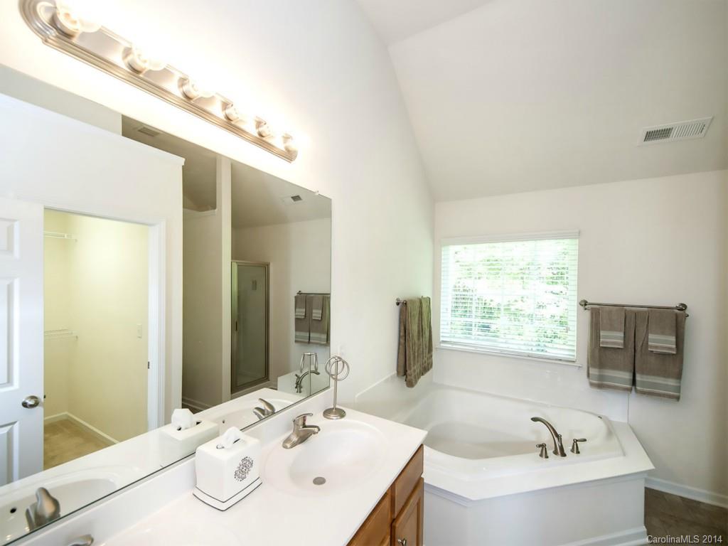 392 Wellridge Drive Fort Mill, SC 29708 - Photo 12 of 21 a bathroom with a tub sink and mirror