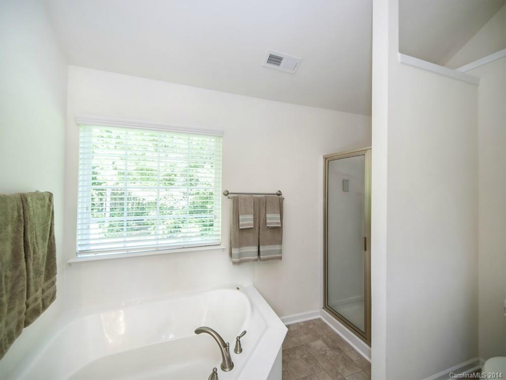 392 Wellridge Drive Fort Mill, SC 29708 - Photo 13 of 21 a en suite bathroom with a bathtub and shower