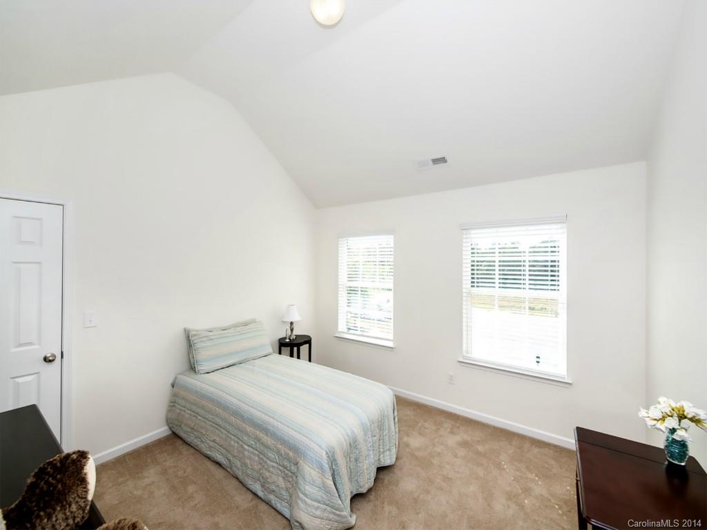 392 Wellridge Drive Fort Mill, SC 29708 - Photo 15 of 21 a bedroom with a bed and a window