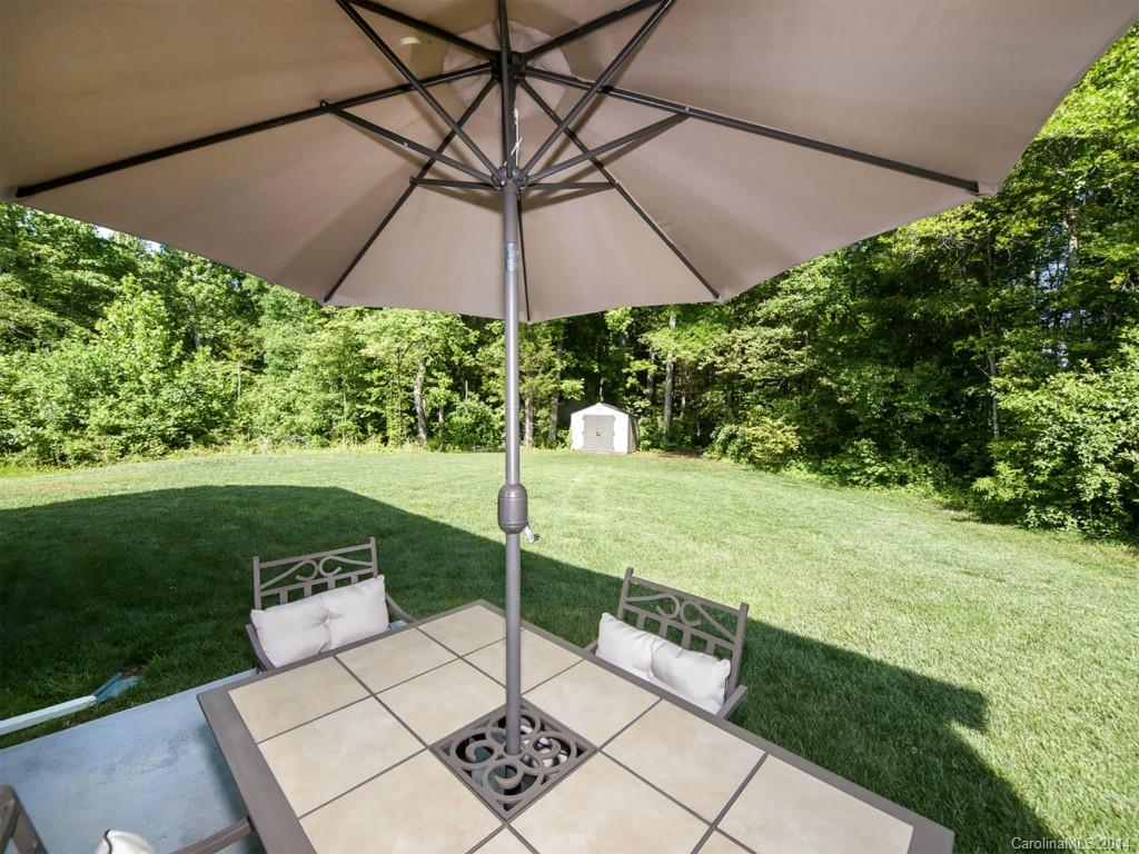 392 Wellridge Drive Fort Mill, SC 29708 - Photo 21 of 21 a view of a table and chairs under an umbrella
