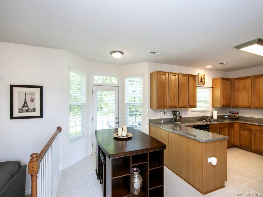 392 Wellridge Drive Fort Mill, SC 29708 - Photo 7 of 21 a kitchen with a sink a counter top space and stainless steel appliances
