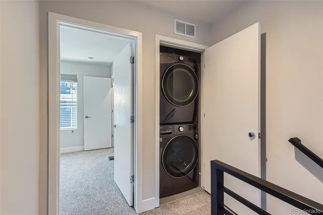a view of a hallway with washer and dryer