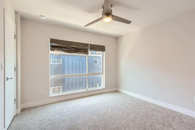 an empty room with a empty space and windows