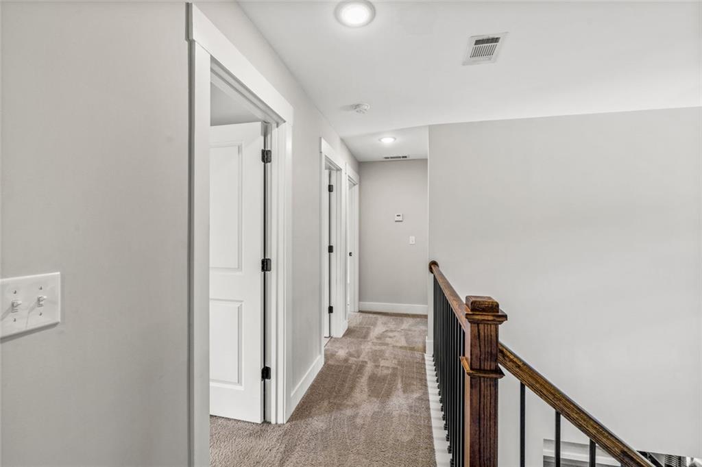 1701 Trotters Court Monroe, GA 30656 - Photo 21 of 41 a view of a hallway with closet and a bathroom