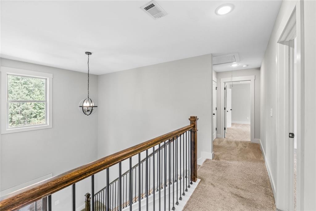 1701 Trotters Court Monroe, GA 30656 - Photo 22 of 41 a view of a hallway with a window