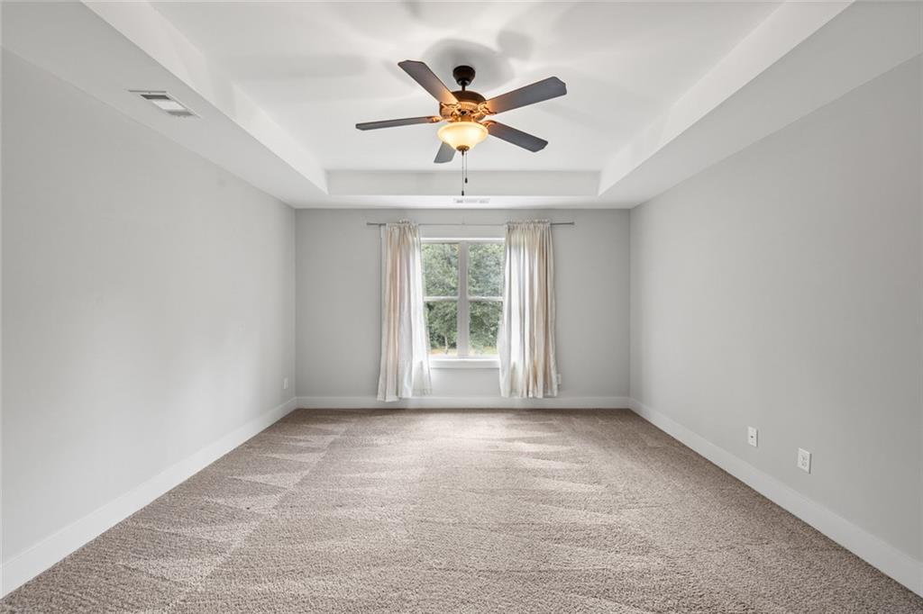 1701 Trotters Court Monroe, GA 30656 - Photo 24 of 41 a view of room with window and a ceiling fan