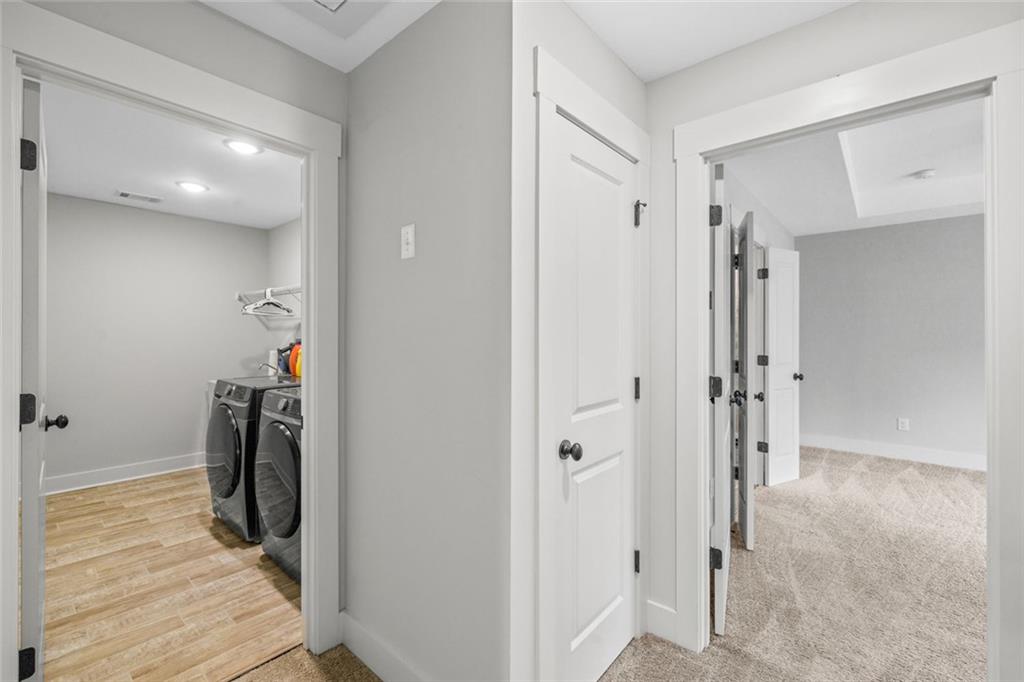 1701 Trotters Court Monroe, GA 30656 - Photo 38 of 41 a view of a hallway with walk in closet and bathroom