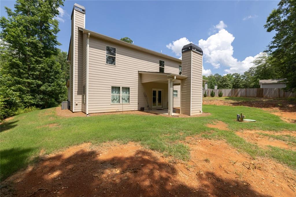 1701 Trotters Court Monroe, GA 30656 - Photo 6 of 41 a backyard of a house with lots of green space