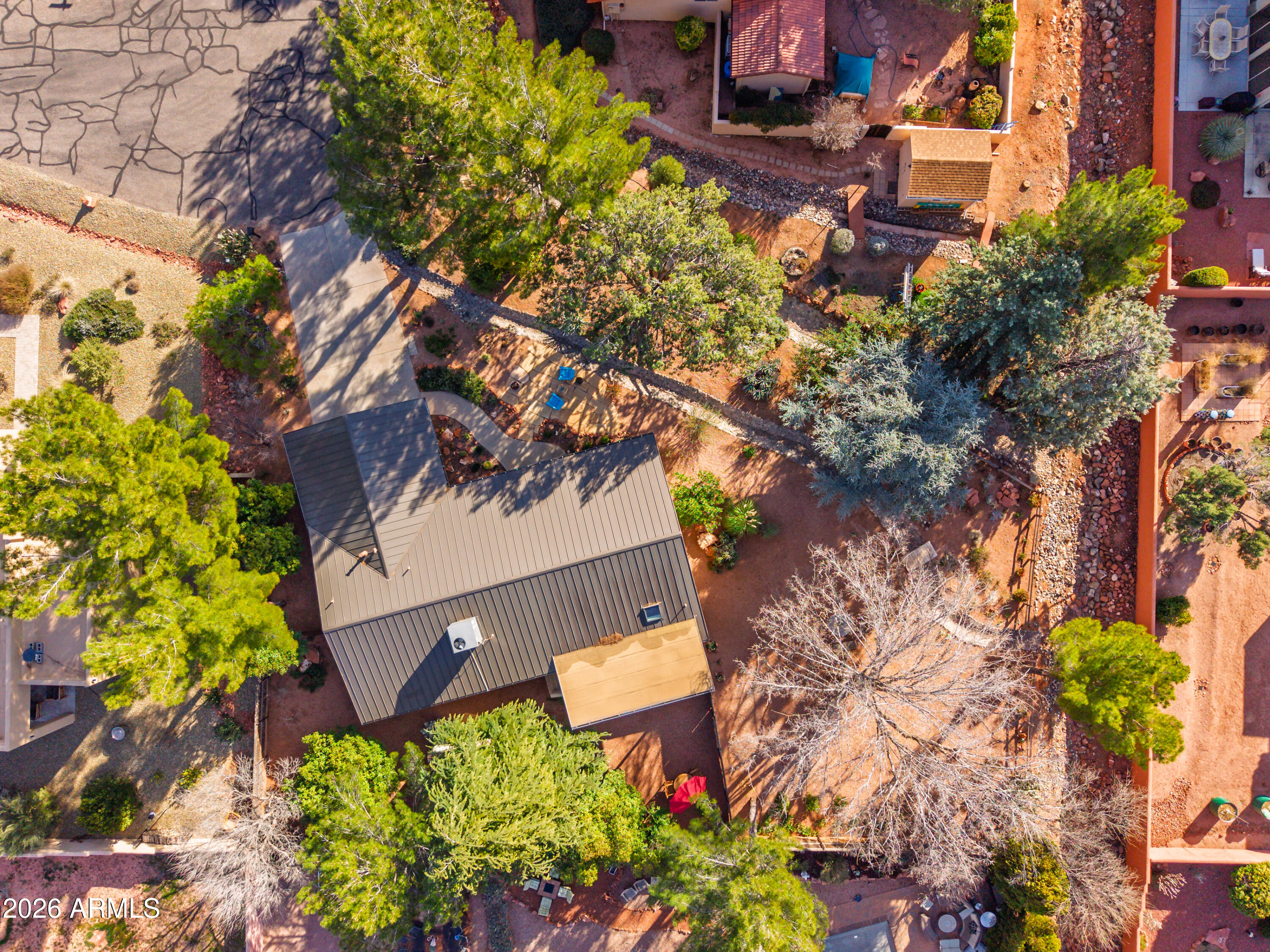 190 Creek Rock Road Sedona, AZ 86351 - Photo 36 of 41 front view of a house with a yard and flowers