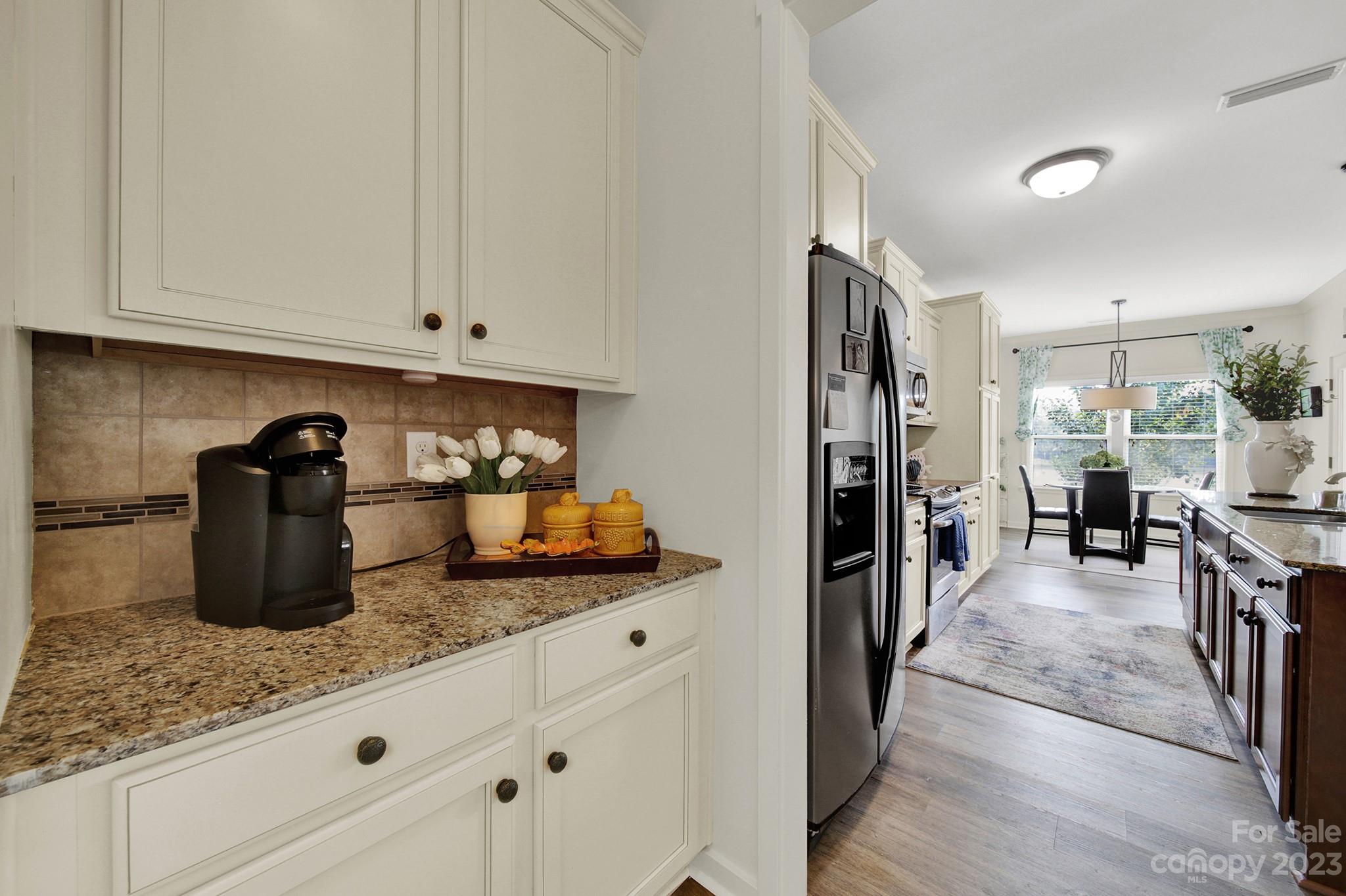 25554 Seagull Drive Lancaster, SC 29720 - Photo 17 of 33 a kitchen with granite countertop a refrigerator a stove and a sink