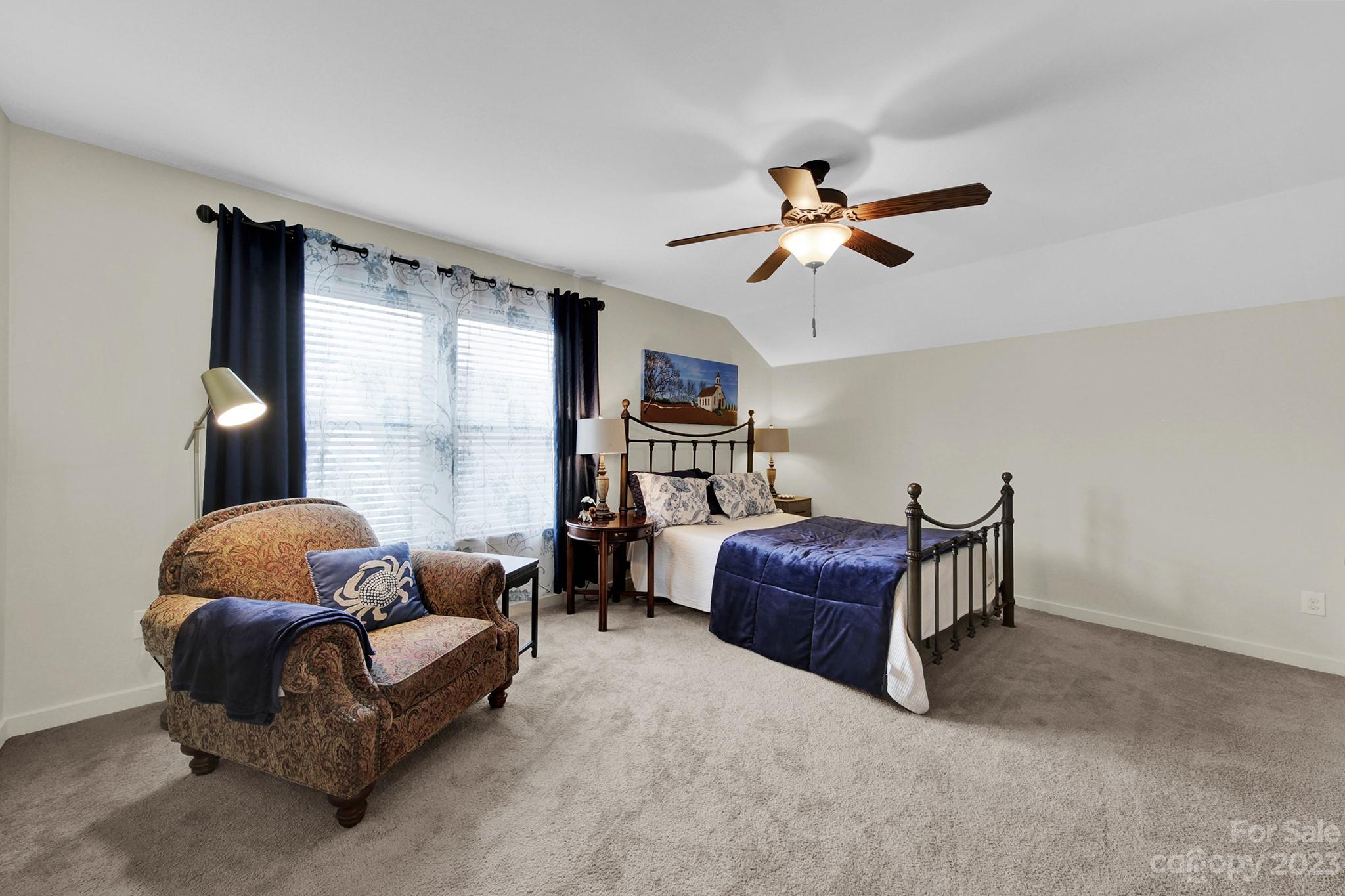 25554 Seagull Drive Lancaster, SC 29720 - Photo 26 of 33 a living room with furniture a ceiling fan and a window