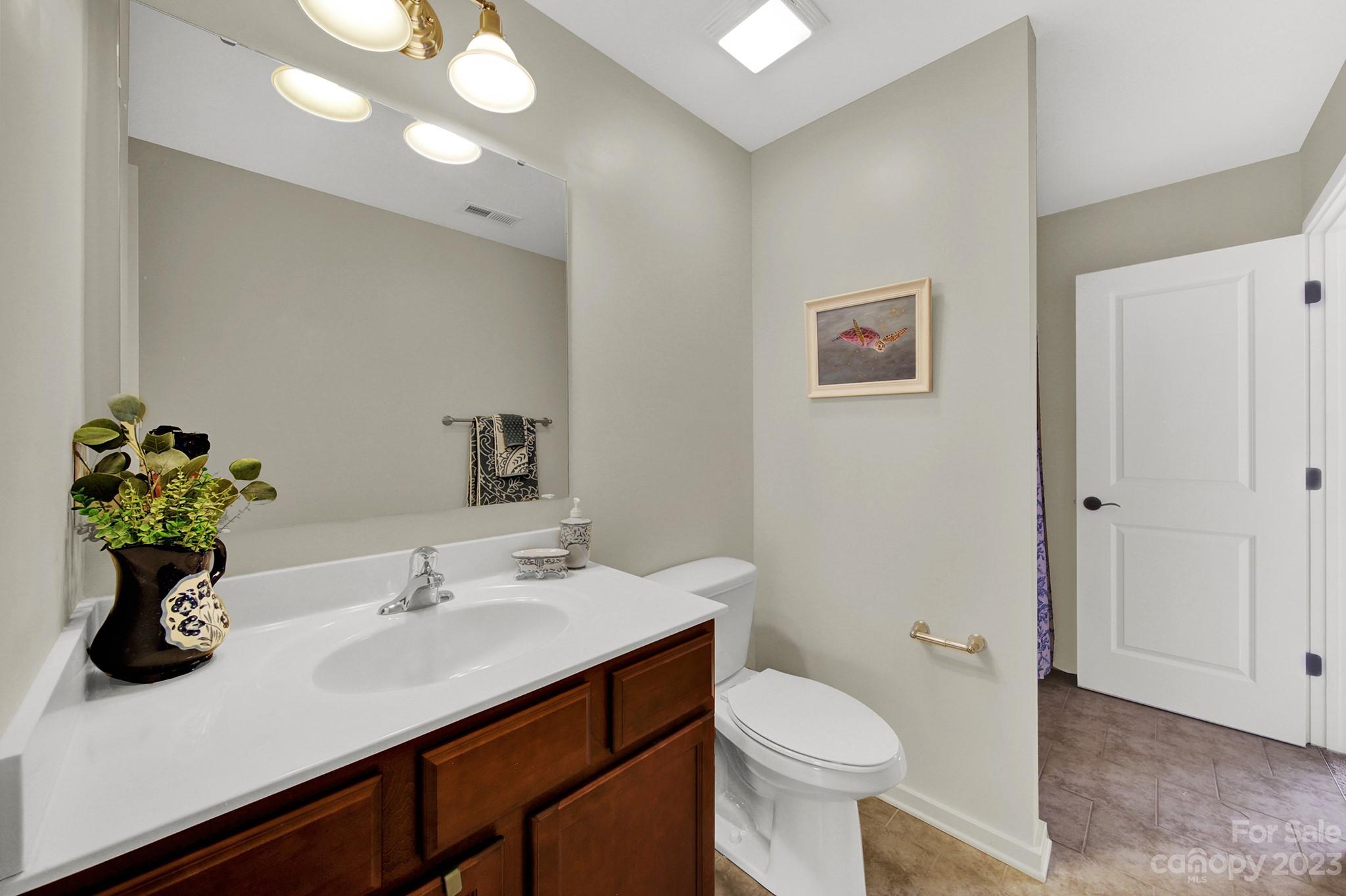 25554 Seagull Drive Lancaster, SC 29720 - Photo 27 of 33 a bathroom with a sink toilet and a mirror