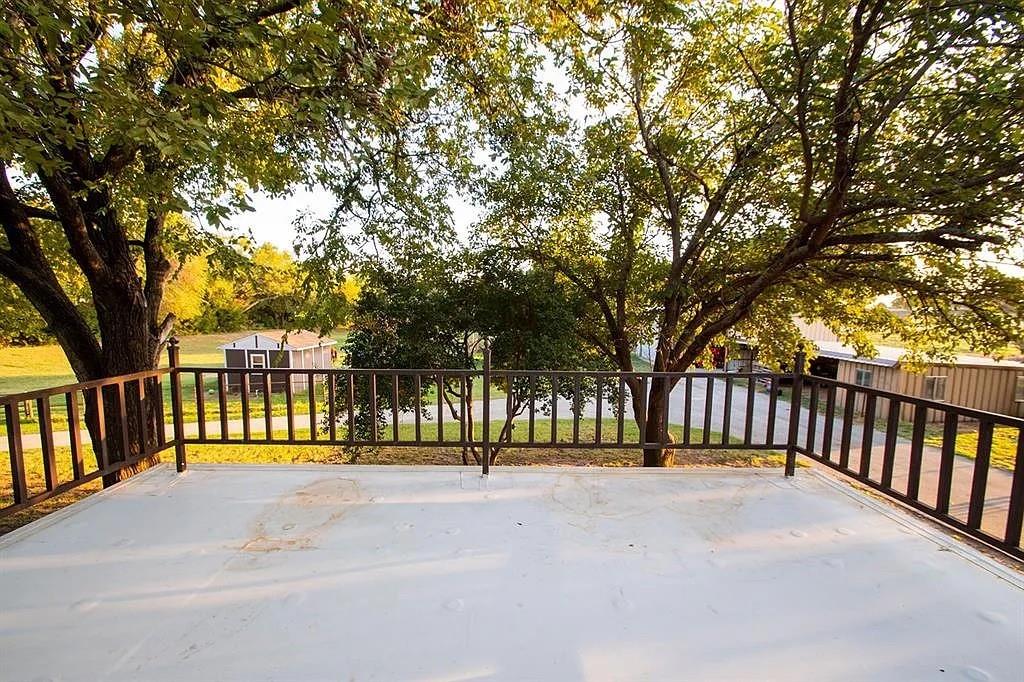 171 County Road 1160 Decatur, TX 76234 - Photo 13 of 22 a view of street with a bench