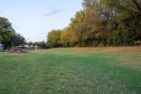 a view of outdoor space with deck and yard