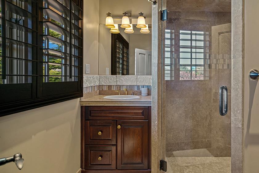 3017 Cormorant Road Pebble Beach, CA 93953 - Photo 21 of 42 a bathroom with a sink and a mirror