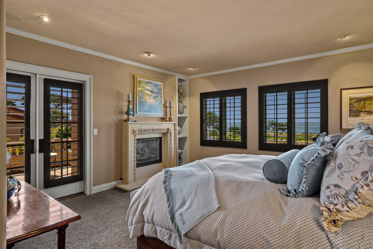 3017 Cormorant Road Pebble Beach, CA 93953 - Photo 22 of 42 a spacious bedroom with a bed and a dresser next to a window