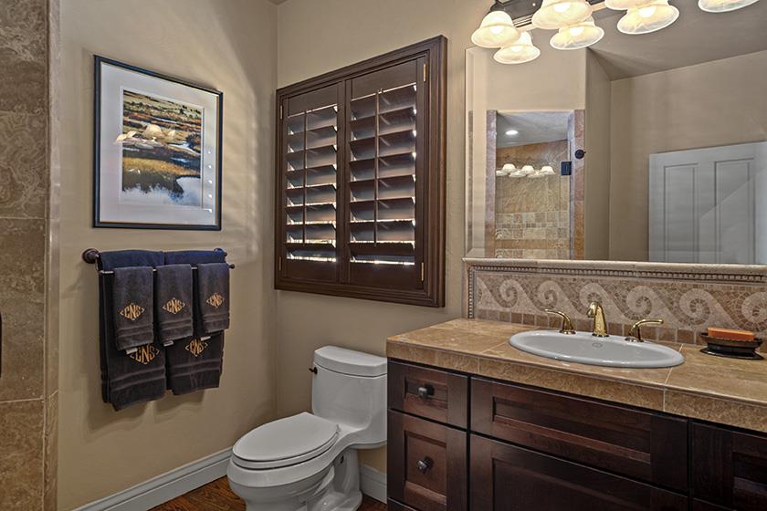 3017 Cormorant Road Pebble Beach, CA 93953 - Photo 28 of 42 a bathroom with a sink a toilet and mirror