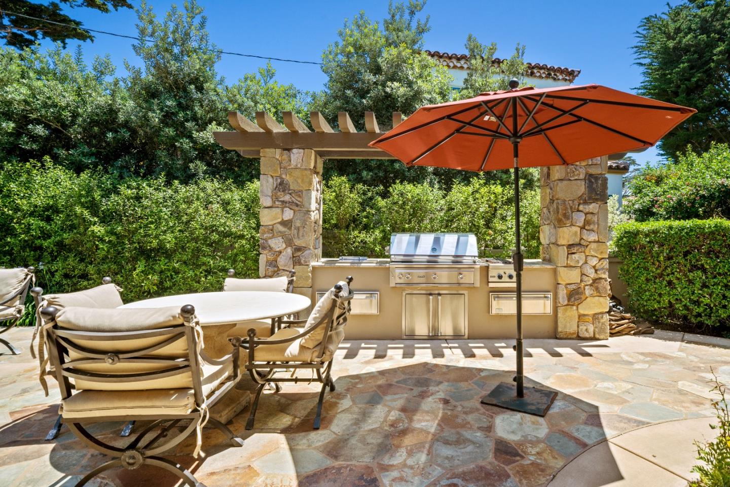 3017 Cormorant Road Pebble Beach, CA 93953 - Photo 34 of 42 a patio with a patio table and chairs