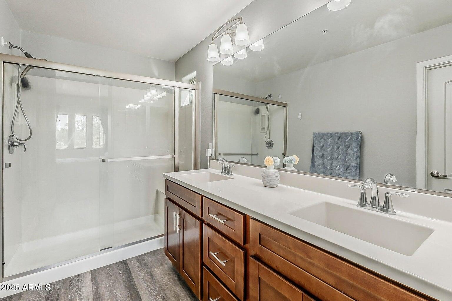 2821 South Skyline Drive, Unit 141 Mesa, AZ 85212 - Photo 24 of 68 a bathroom with a double vanity sink mirror double and shower