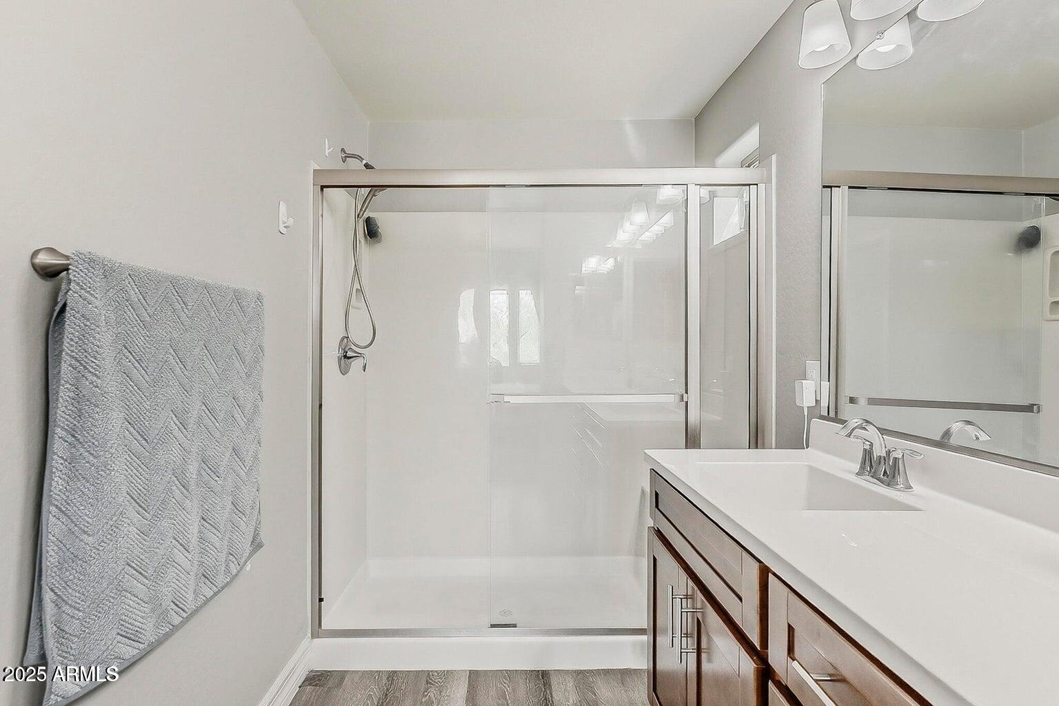 2821 South Skyline Drive, Unit 141 Mesa, AZ 85212 - Photo 26 of 68 a bathroom with a shower and a sink