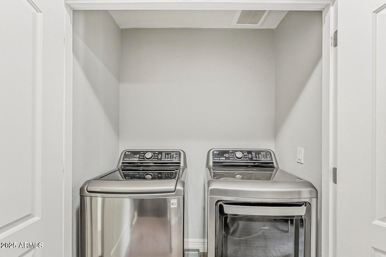 2821 South Skyline Drive, Unit 141 Mesa, AZ 85212 - Photo 34 of 68 a view of storage and utility room with washer and dryer