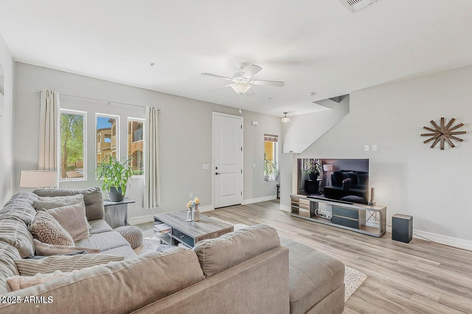 2821 South Skyline Drive, Unit 141 Mesa, AZ 85212 - Photo 3 of 68 a living room with furniture and a flat screen tv