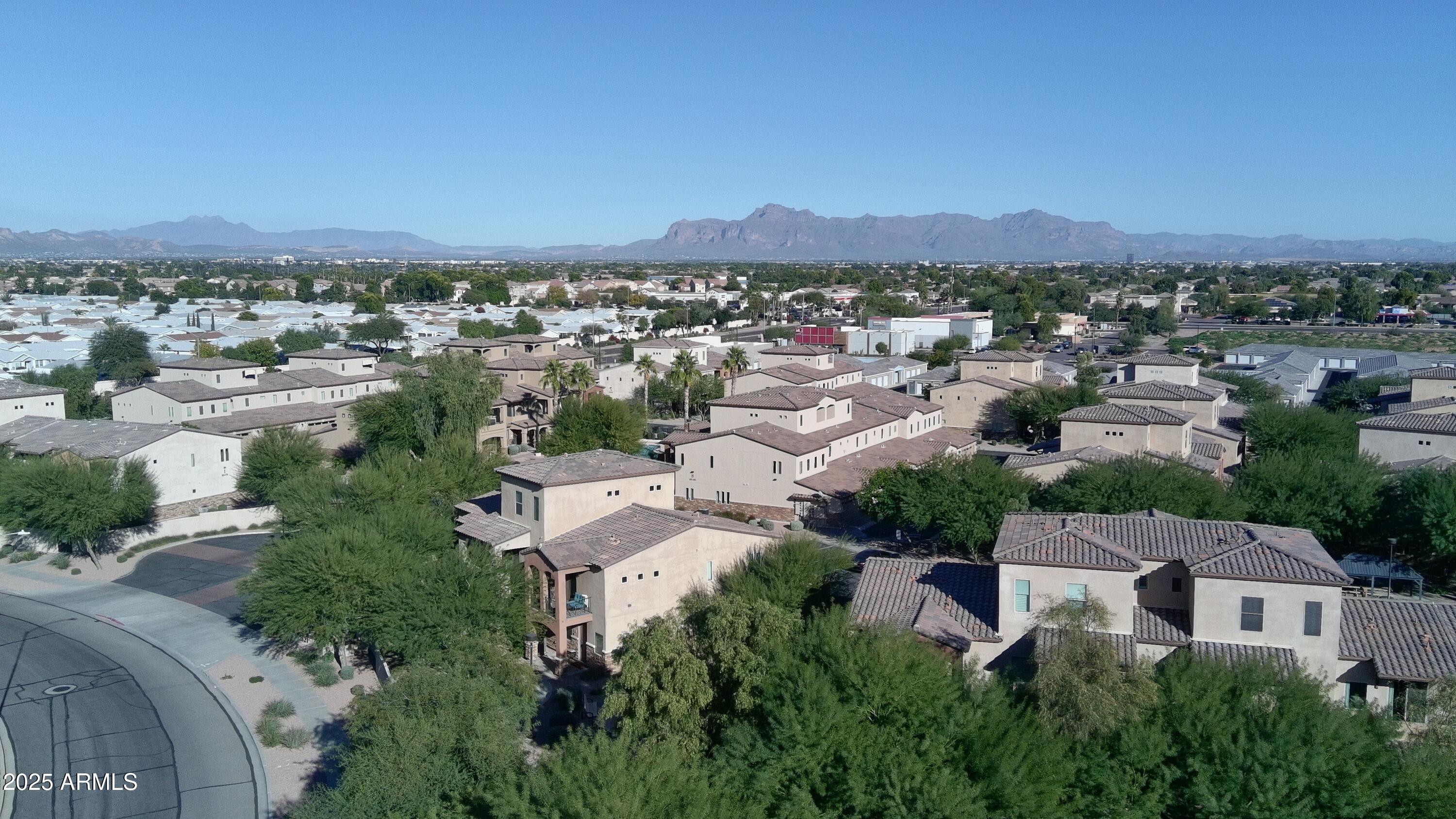 2821 South Skyline Drive, Unit 141 Mesa, AZ 85212 - Photo 50 of 68 an aerial view of residential houses with outdoor space