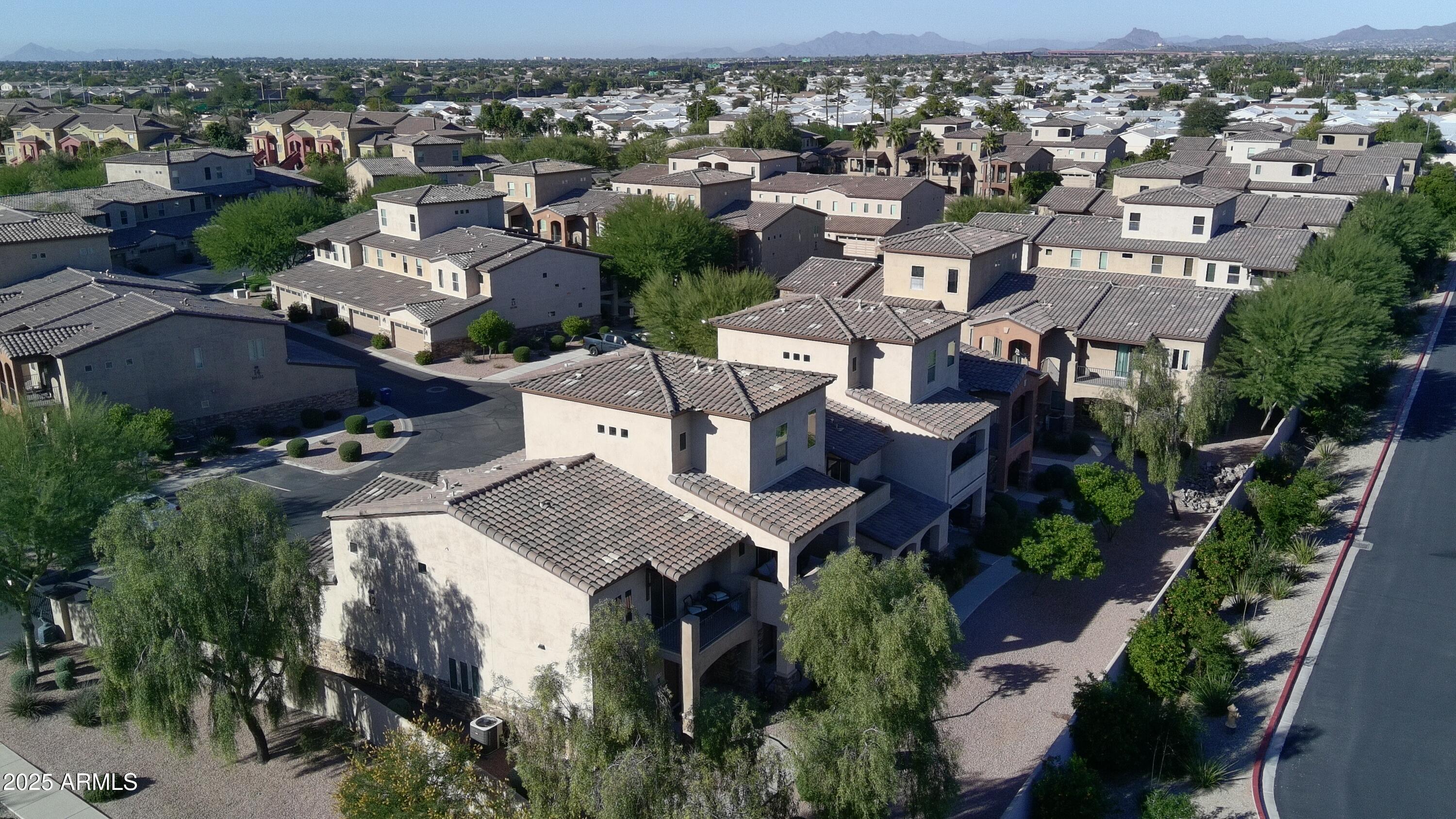 2821 South Skyline Drive, Unit 141 Mesa, AZ 85212 - Photo 67 of 68 an aerial view of multiple houses with yard