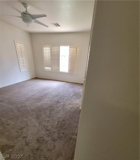 677 Principle Point Avenue Henderson, NV 89012 - Photo 12 of 40 Carpeted spare room with a ceiling fan