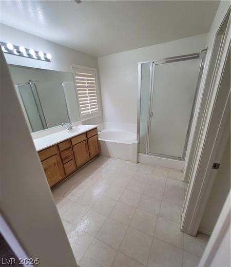 677 Principle Point Avenue Henderson, NV 89012 - Photo 19 of 40 Bathroom with a stall shower, vanity, and a bath