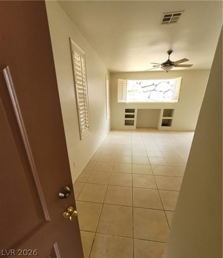 677 Principle Point Avenue Henderson, NV 89012 - Photo 2 of 40 Hall with light tile patterned flooring