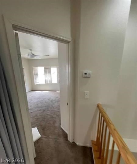 677 Principle Point Avenue Henderson, NV 89012 - Photo 26 of 40 Corridor with dark colored carpet and an upstairs landing